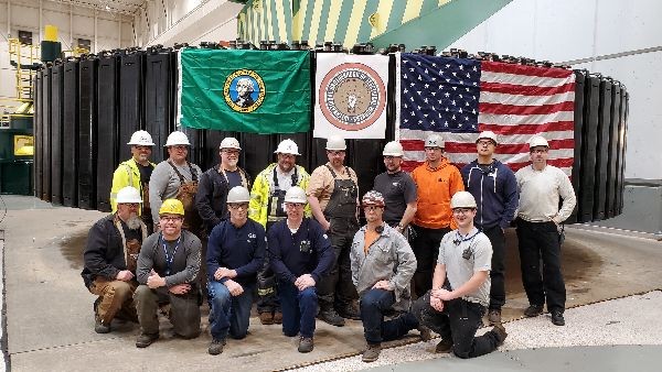 Group of employees in front of final rotor