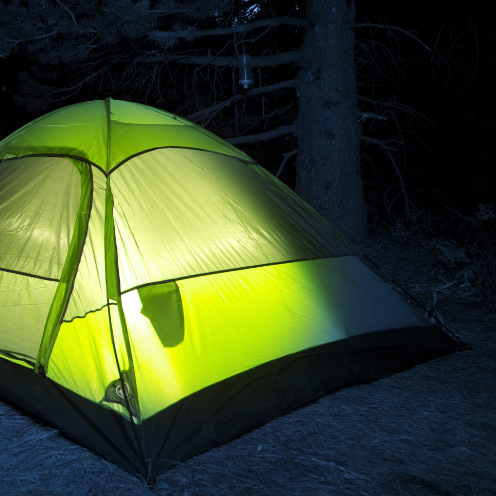 Camp tent with glowing light inside